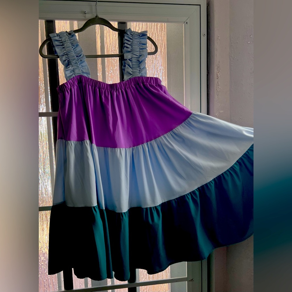 Beautiful swing mini dress. Great colors. Lightly used.
